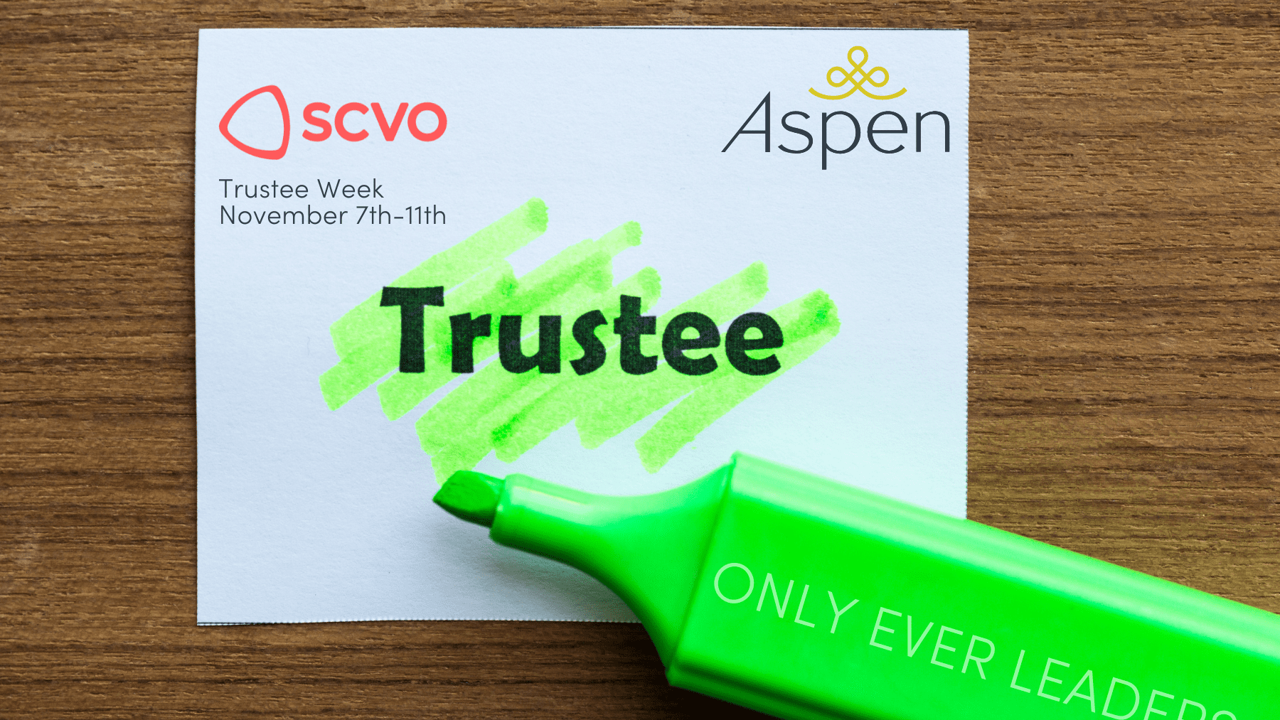 Square piece of paper with the word 'Trustee' highlighted with a neon green highlighter pen. The pen is on top of the paper at an angle but under the word.